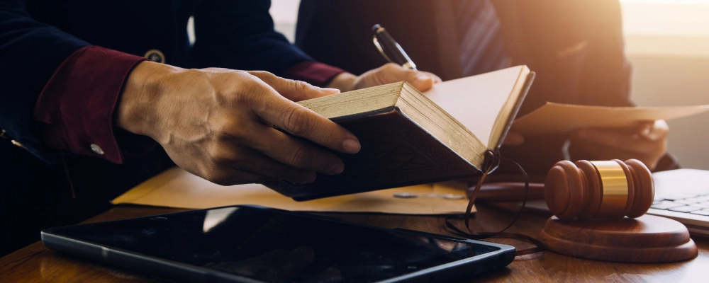 An Albuquerque Employment Immigration Lawyer holding an open book.