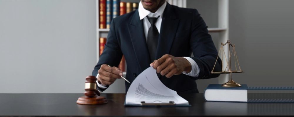 An Albuquerque immigration lawyer browsing a client's documents on his desk.