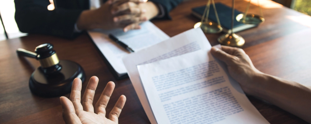An Albuquerque Waivers of Inadmissibility Lawyer reading some documents.
